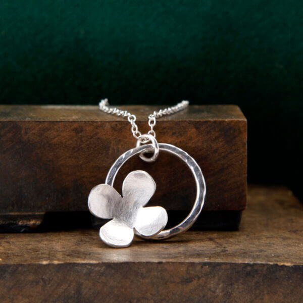 simple flower in circle pendant