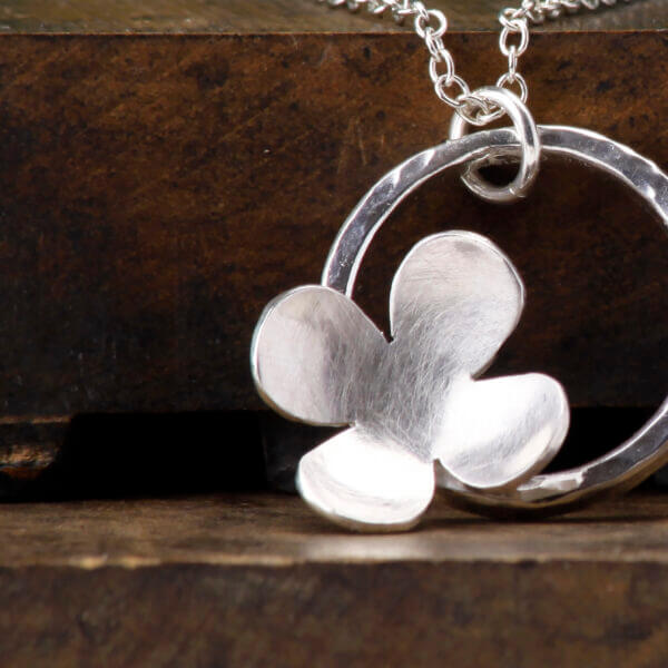 simple flower in circle pendant