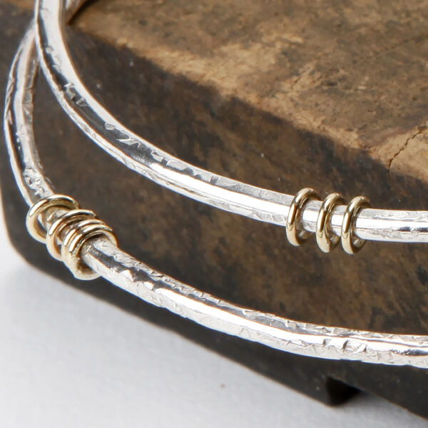 sterling silver bangles with 9ct gold ring detail